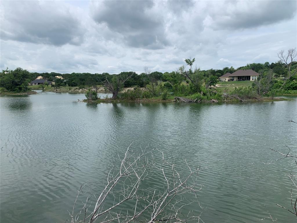0 Anglers Point Bluff Dale, TX 76433 - Photo 2 of 35 a view of a lake with houses in the back