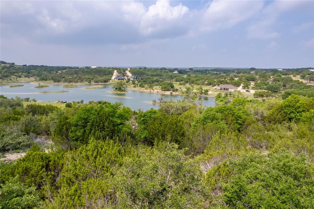 0 Anglers Point Bluff Dale, TX 76433 - Photo 22 of 35 a view of a lake with houses in the back