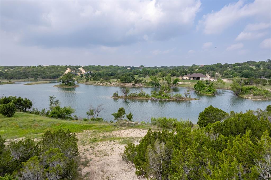 0 Anglers Point Bluff Dale, TX 76433 - Photo 25 of 35 a view of a lake with houses in the back