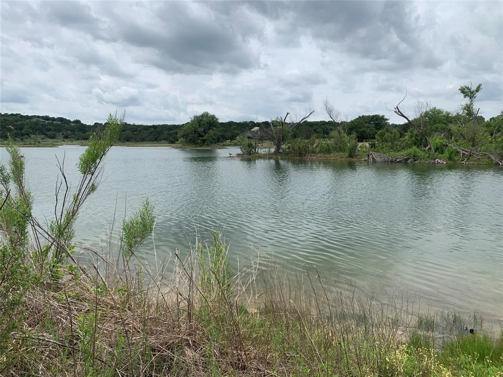 0 Anglers Point Bluff Dale, TX 76433 - Photo 4 of 35 a view of a lake with houses in the back