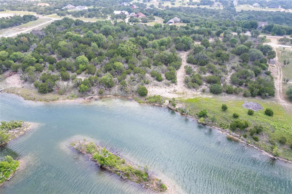 0 Anglers Point Bluff Dale, TX 76433 - Photo 8 of 35 a view of a road with a yard and trees