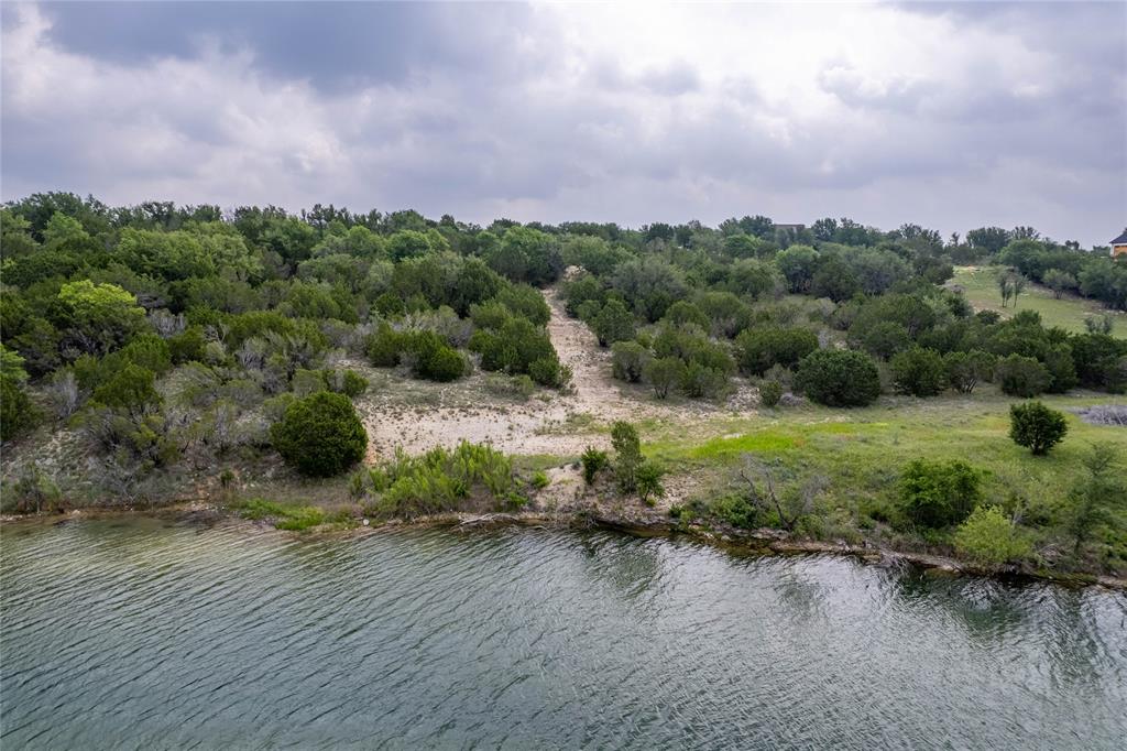 0 Anglers Point Bluff Dale, TX 76433 - Photo 9 of 35 a view of a lake with houses in the back