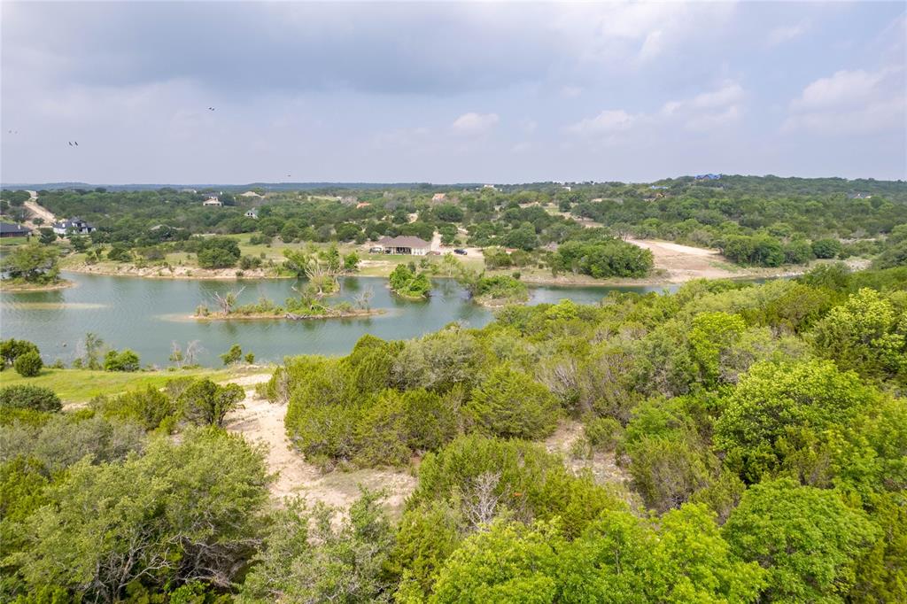 0 Anglers Point Bluff Dale, TX 76433 - Photo 10 of 35 a view of a lake with houses in the background