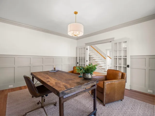 a view of a livingroom with furniture and wooden floor