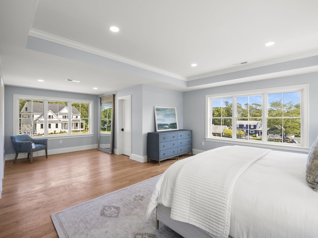 Lot 7 Weeping Willow Drive Andover, MA 01810 - Photo 19 of 42 a spacious bedroom with a large bed and a large window