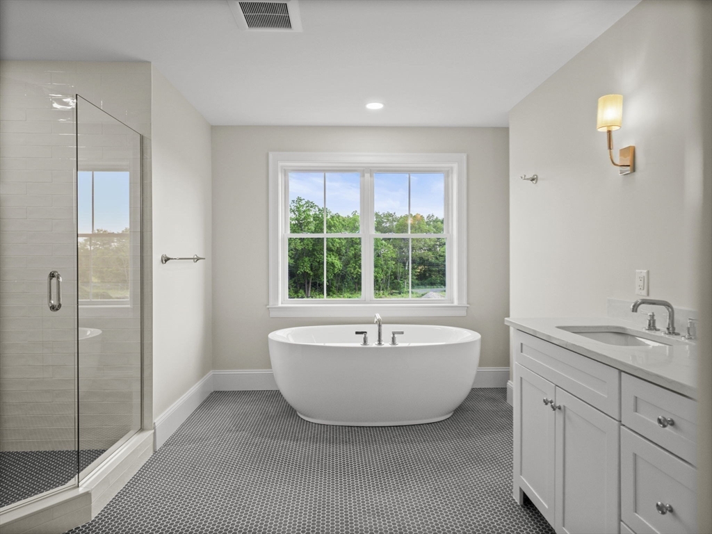 Lot 7 Weeping Willow Drive Andover, MA 01810 - Photo 22 of 42 a spacious bathroom with a bathtub sink and mirror