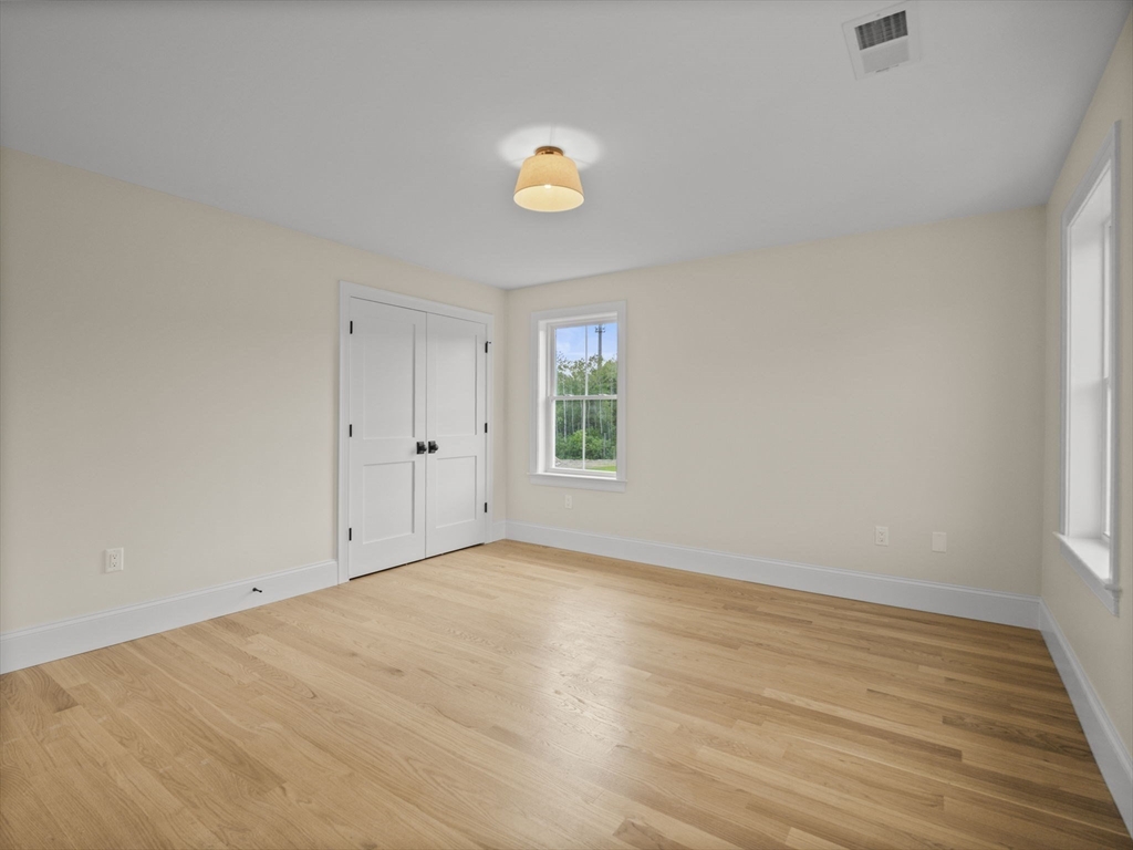 Lot 7 Weeping Willow Drive Andover, MA 01810 - Photo 27 of 42 a view of empty room with wooden floor and window