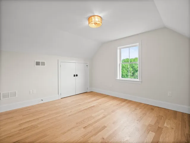 an empty room with a empty space and a window