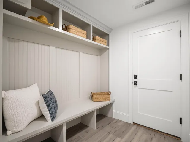 a view of room with furniture and wooden floor