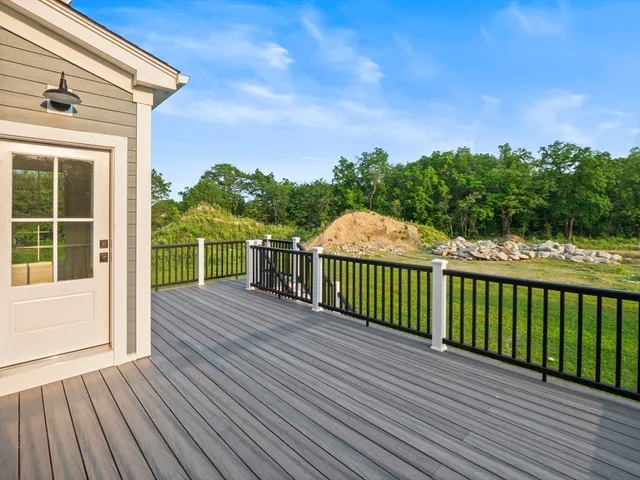 a view of a balcony with wooden floor