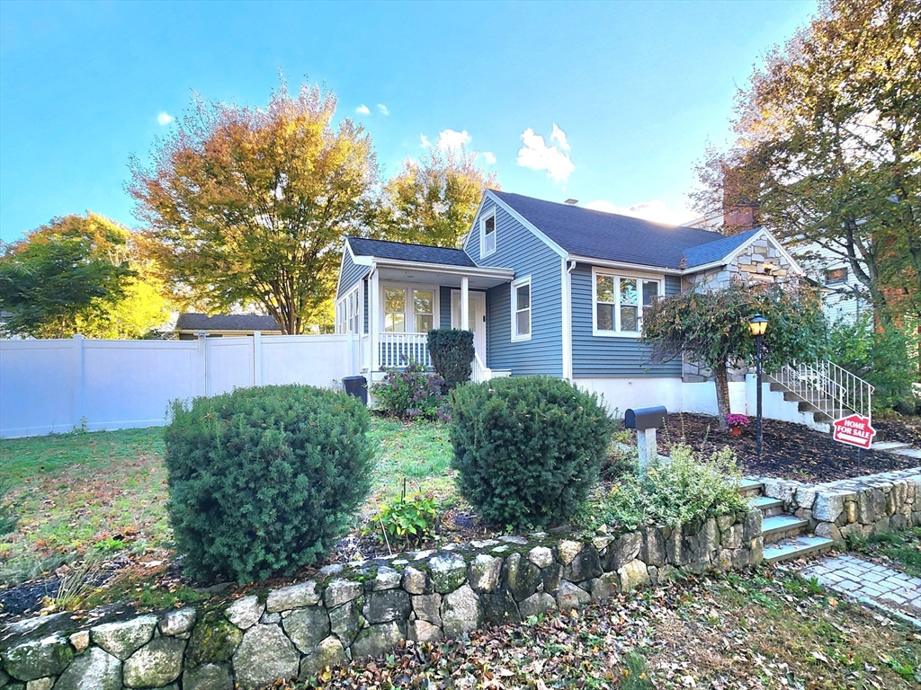 42 Ancona Road Worcester, MA 01604 - Photo 1 of 42 a front view of a house with a yard and a garden