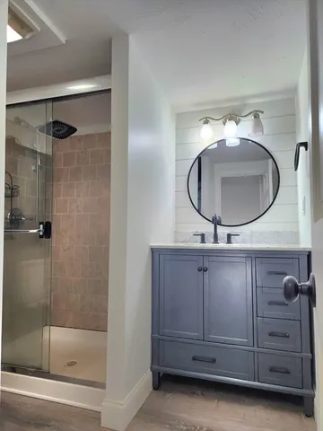 a bathroom with a mirror and a sink