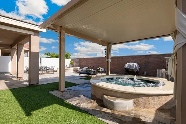 a view of a patio with a table chairs and a patio