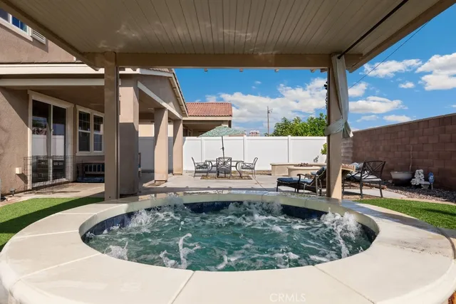 a view of a swimming pool with a patio