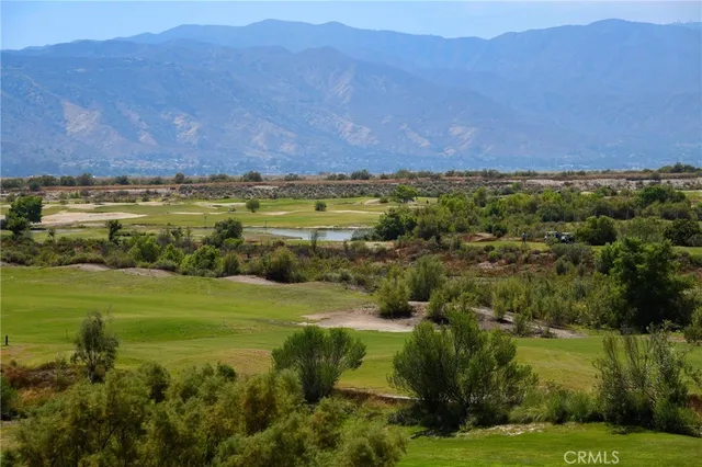 a view of a field with an ocean