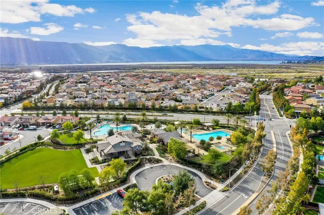 an aerial view of a house with a yard