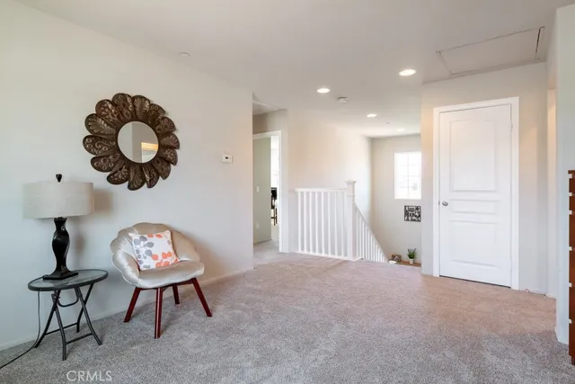 a view of an empty room with a table and a chair