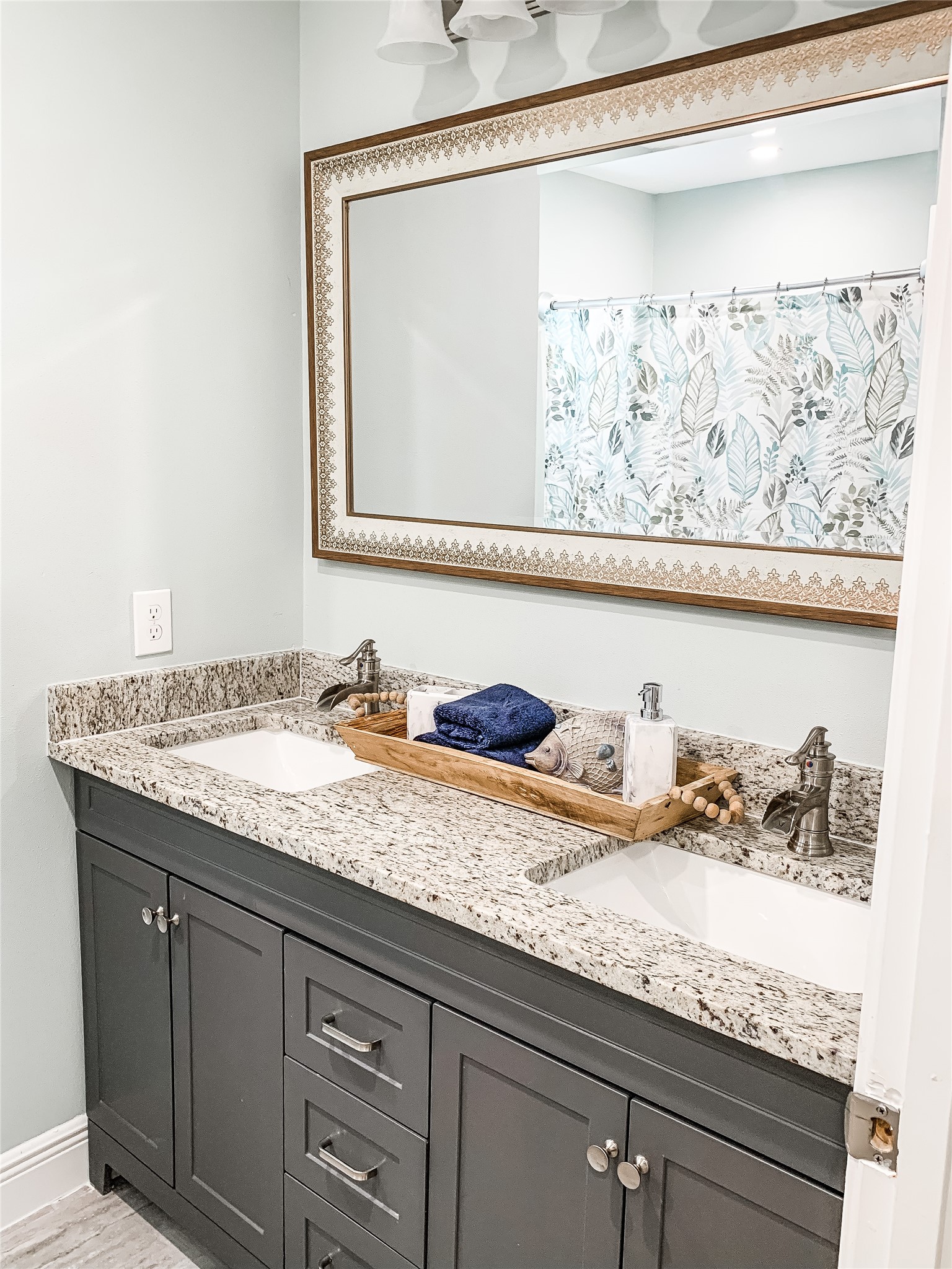246 Seagull Road Sargent, TX 77414 - Photo 16 of 25 a bathroom with a granite countertop sink and a mirror