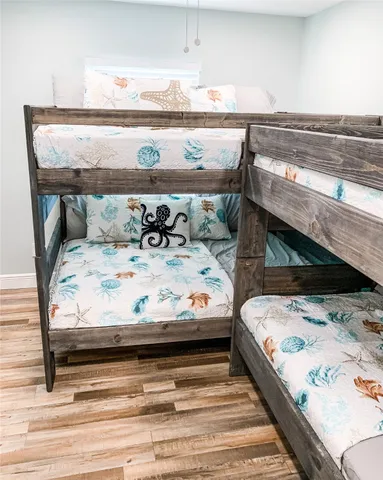 a view of bedroom with furniture and lamp