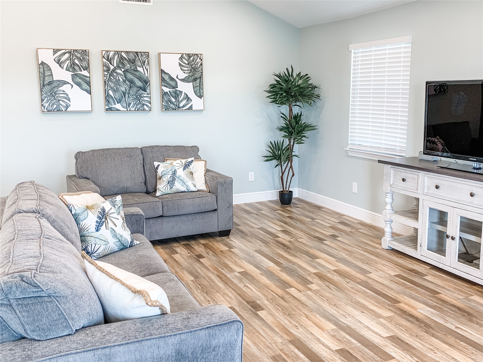 246 Seagull Road Sargent, TX 77414 - Photo 7 of 25 a living room with furniture and a flat screen tv