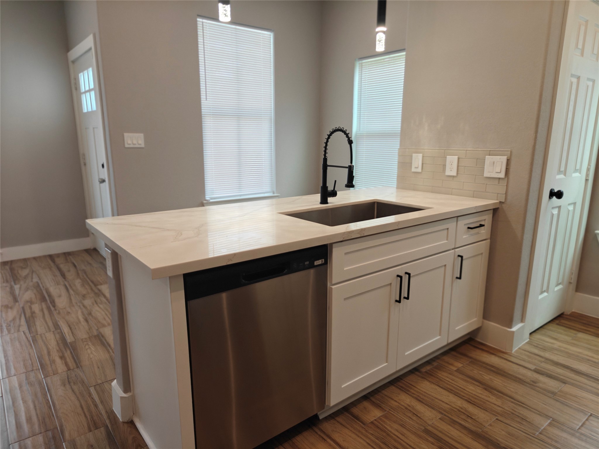 4124 Vaughn Street, Unit A Houston, TX 77016 - Photo 4 of 17 a kitchen with a sink cabinets and wooden floor