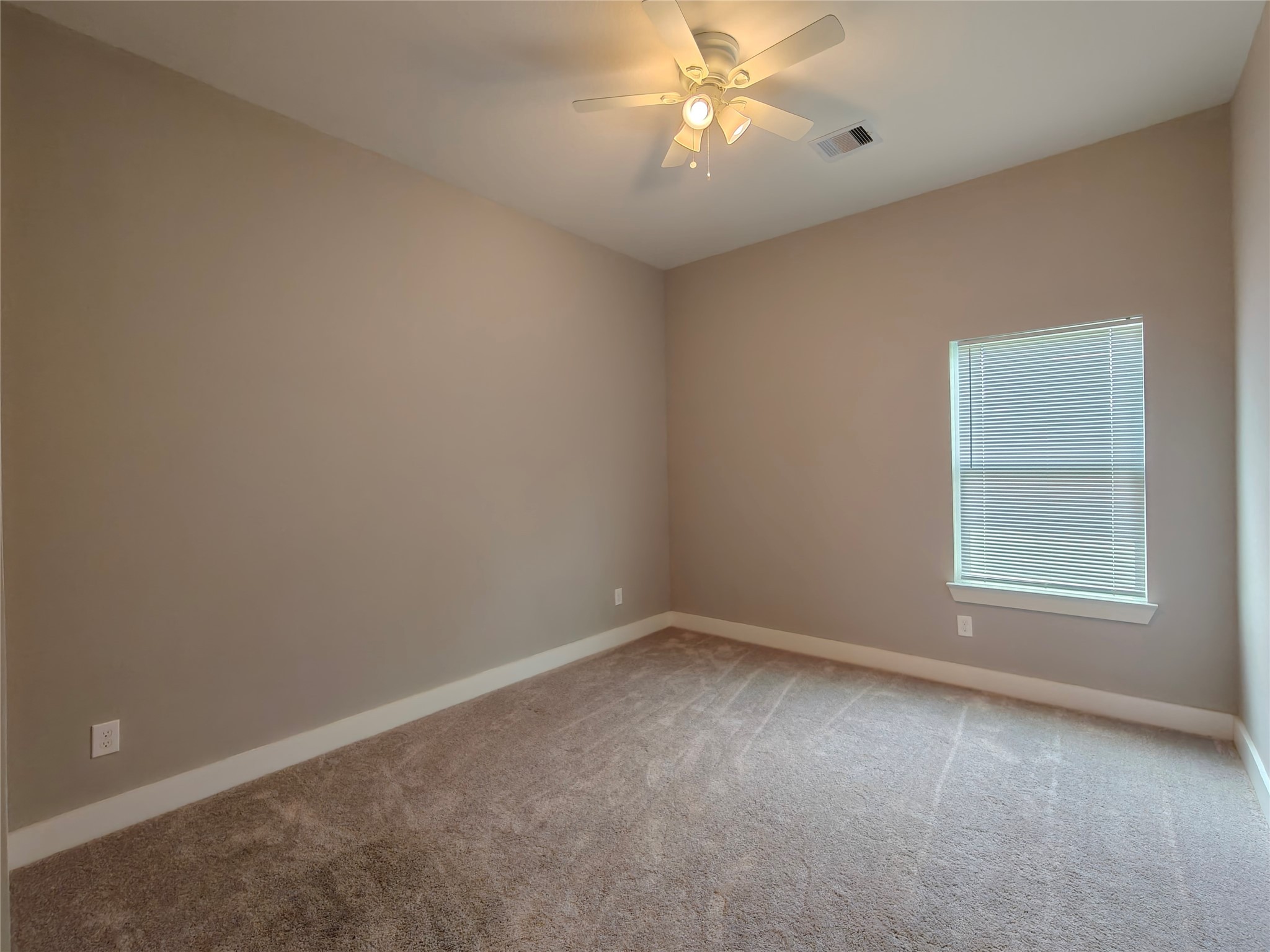 4124 Vaughn Street, Unit A Houston, TX 77016 - Photo 8 of 17 an empty room with a window