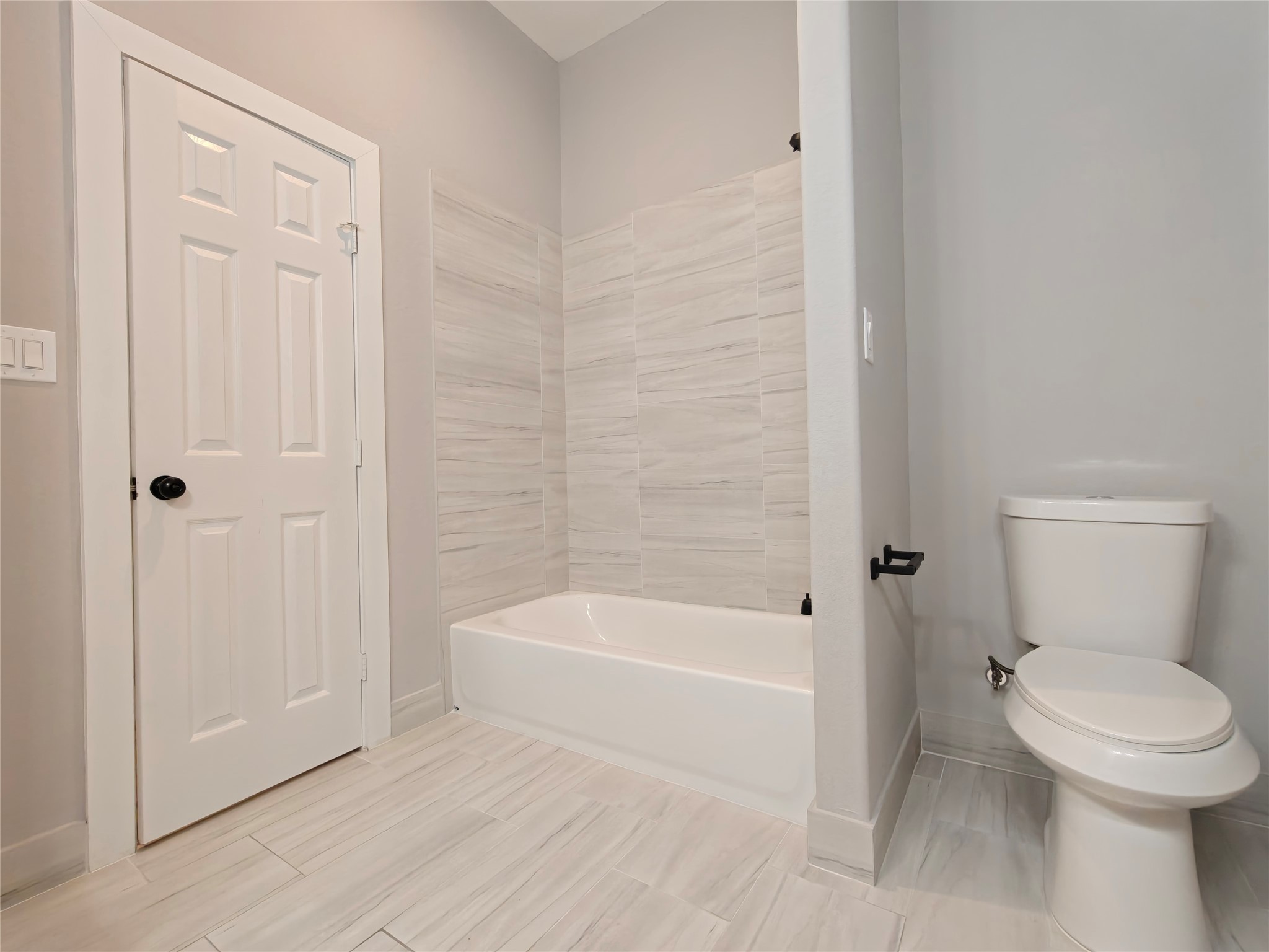 4124 Vaughn Street, Unit A Houston, TX 77016 - Photo 10 of 17 a bathroom with a toilet and a shower