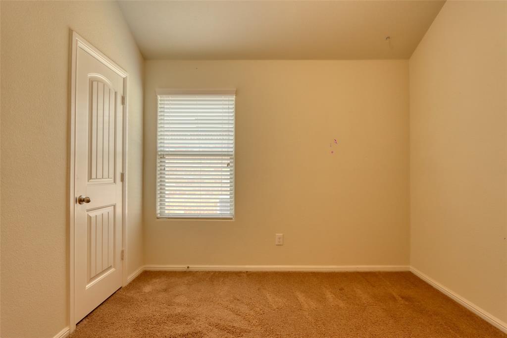 744 Walls Boulevard Crowley, TX 76036 - Photo 18 of 28 an empty room with a window