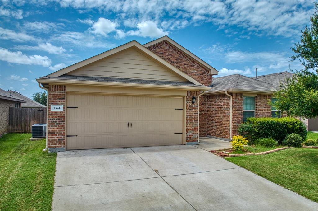 744 Walls Boulevard Crowley, TX 76036 - Photo 2 of 28 a view of a house with yard and plants