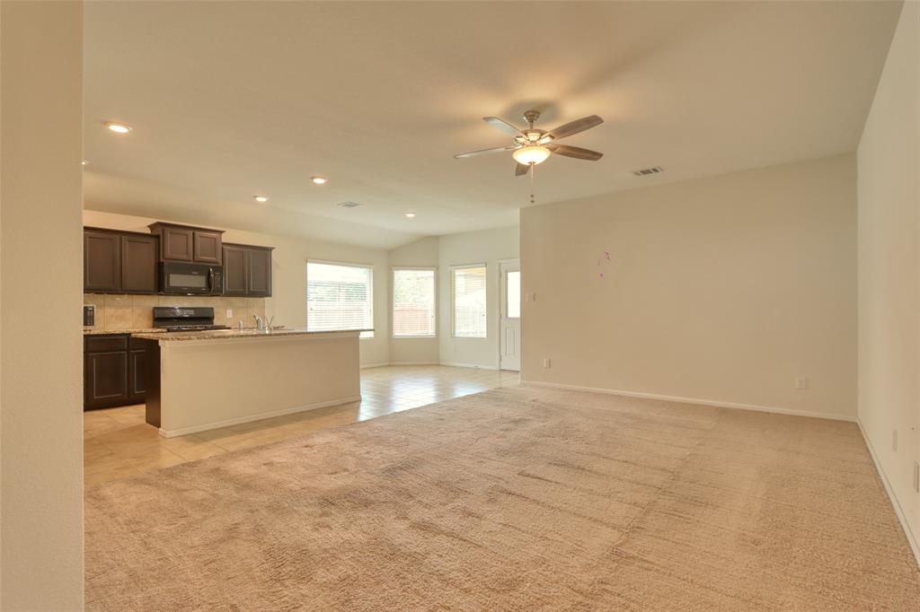 744 Walls Boulevard Crowley, TX 76036 - Photo 4 of 28 a view of a kitchen with a sink and a window