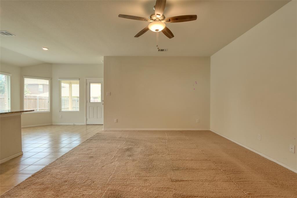 744 Walls Boulevard Crowley, TX 76036 - Photo 5 of 28 a view of an empty room with a window