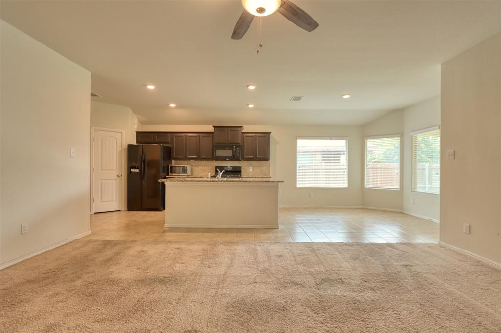 744 Walls Boulevard Crowley, TX 76036 - Photo 7 of 28 a view of a kitchen with a sink and a window