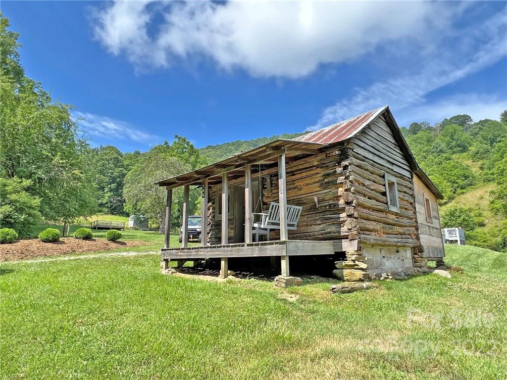 1696 Caney Fork Road Marshall, NC 28753 - Photo 11 of 11 front view of house with a yard
