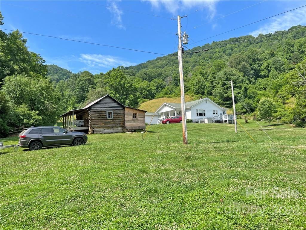 1696 Caney Fork Road Marshall, NC 28753 - Photo 4 of 11 a view of a house with a yard