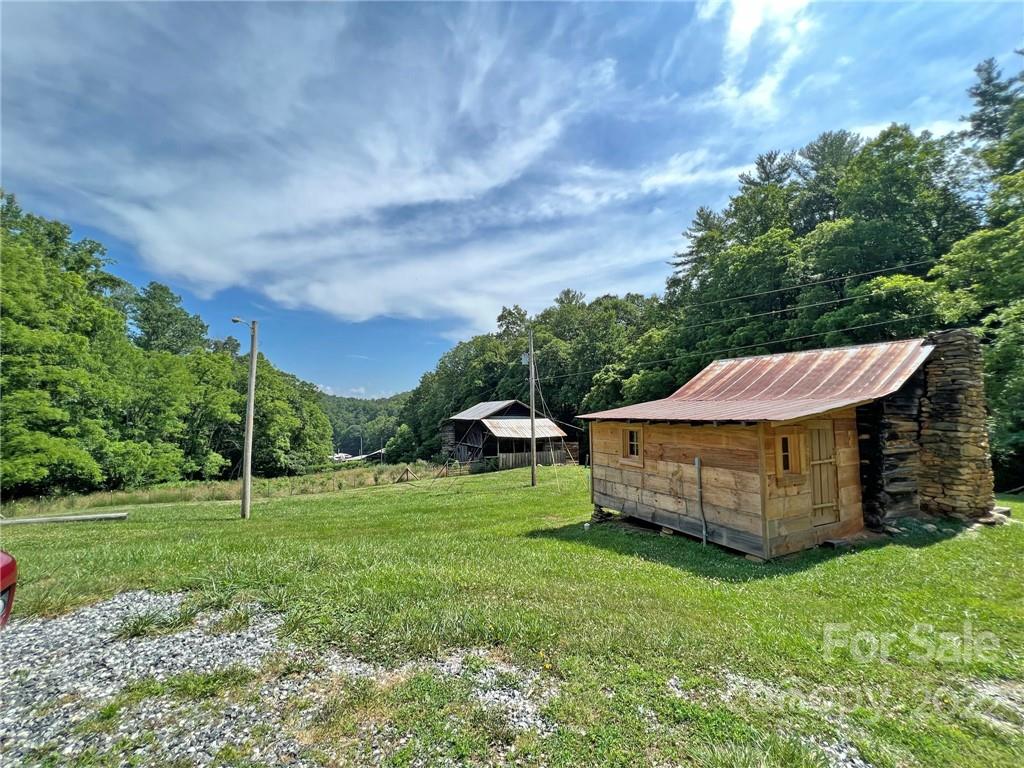 1696 Caney Fork Road Marshall, NC 28753 - Photo 7 of 11 a view of a house with backyard