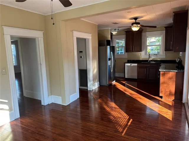 a view of a living room and wooden floor