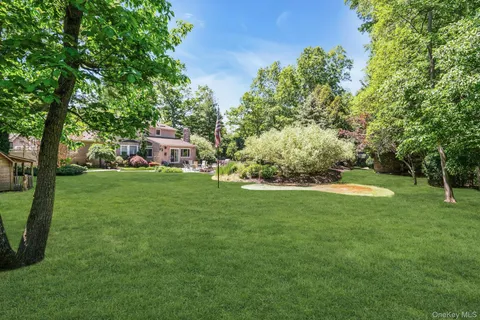 a view of a house with a backyard