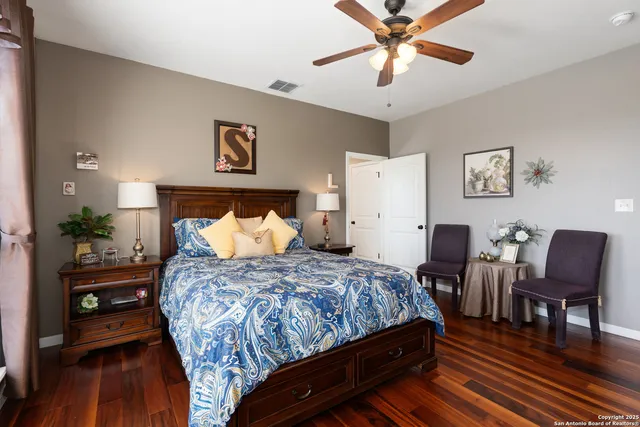 a bedroom with a bed and a dresser