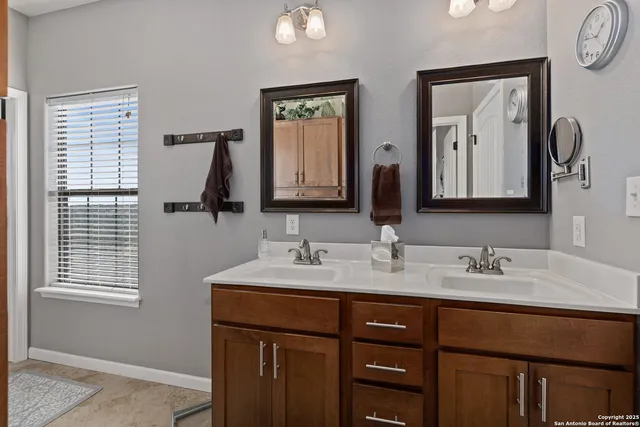 a bathroom with a shower and a glass door