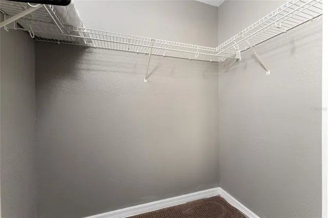 an aerial view of a city with lake view and houses in the back