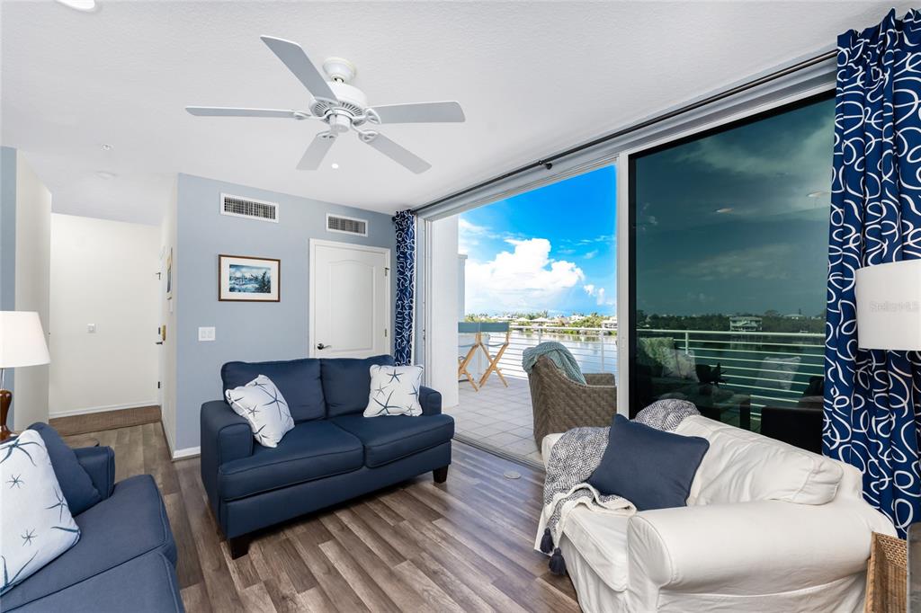 8013 Bay Point Drive Englewood, FL 34224 - Photo 56 of 82 a living room with furniture and a large window