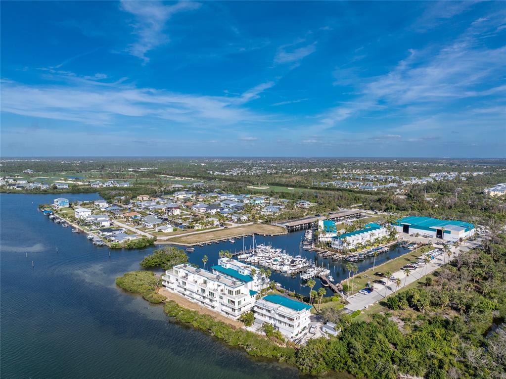8013 Bay Point Drive Englewood, FL 34224 - Photo 82 of 82 an aerial view of ocean and residential houses with outdoor space