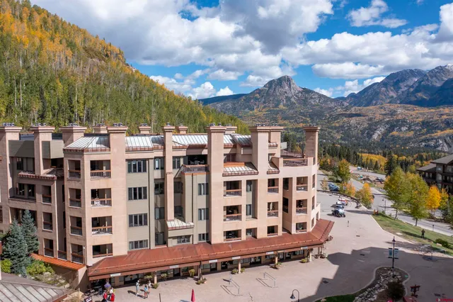 a view of a building with a yard