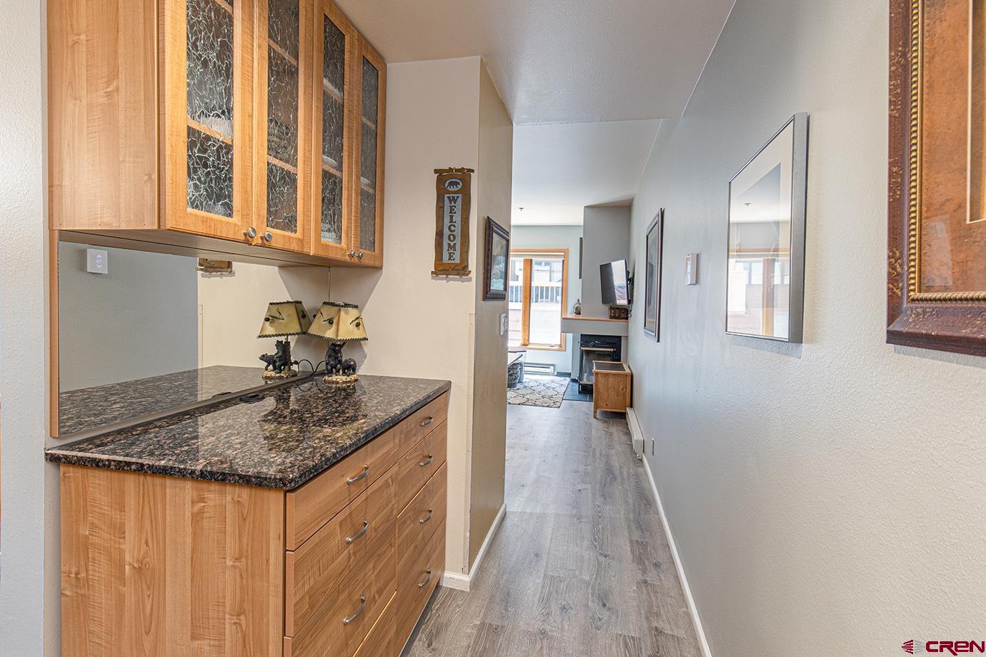 71 Needles Way, Unit 343 Durango, CO 81301 - Photo 3 of 18 a kitchen with stainless steel appliances granite countertop a sink stove and cabinets