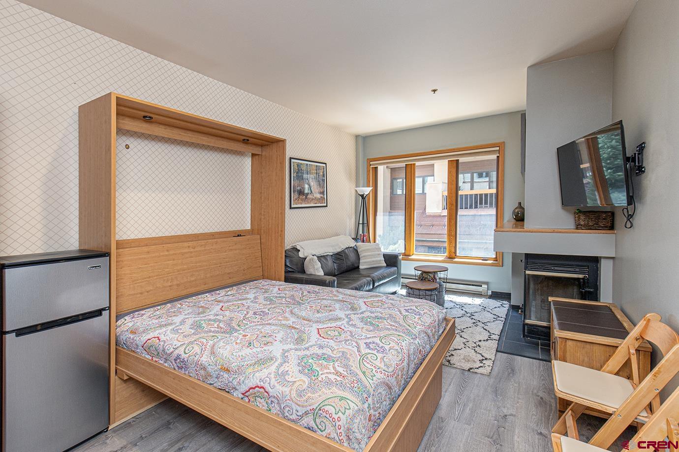 71 Needles Way, Unit 343 Durango, CO 81301 - Photo 7 of 18 a bedroom with a bed and a fireplace