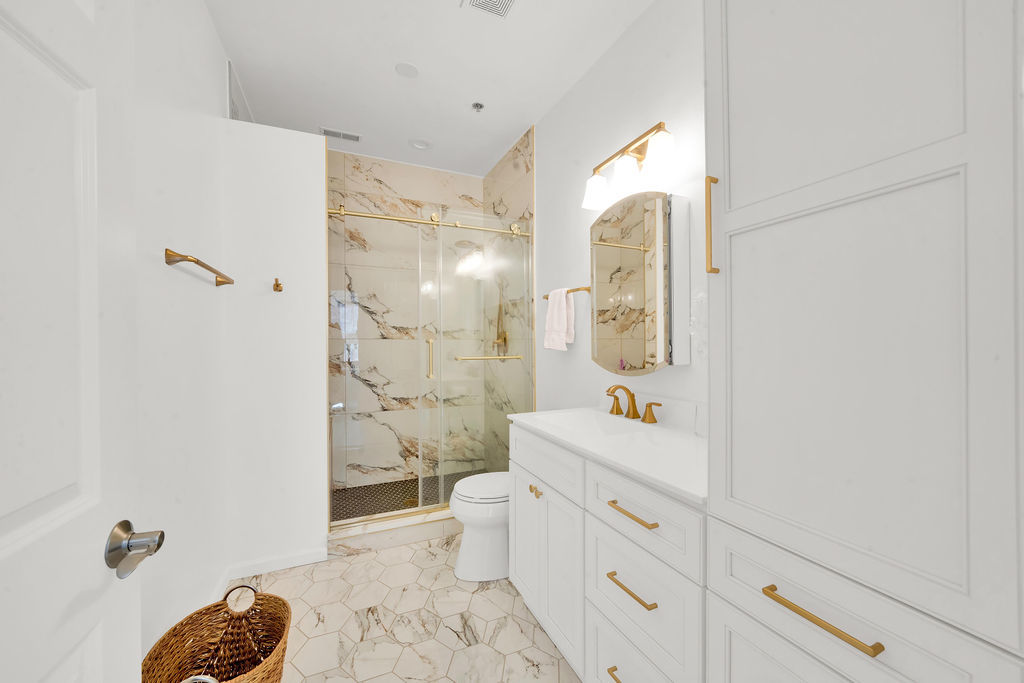 324 East 17th Street Chicago, IL 60616 - Photo 15 of 25 a bathroom with a sink a toilet and shower