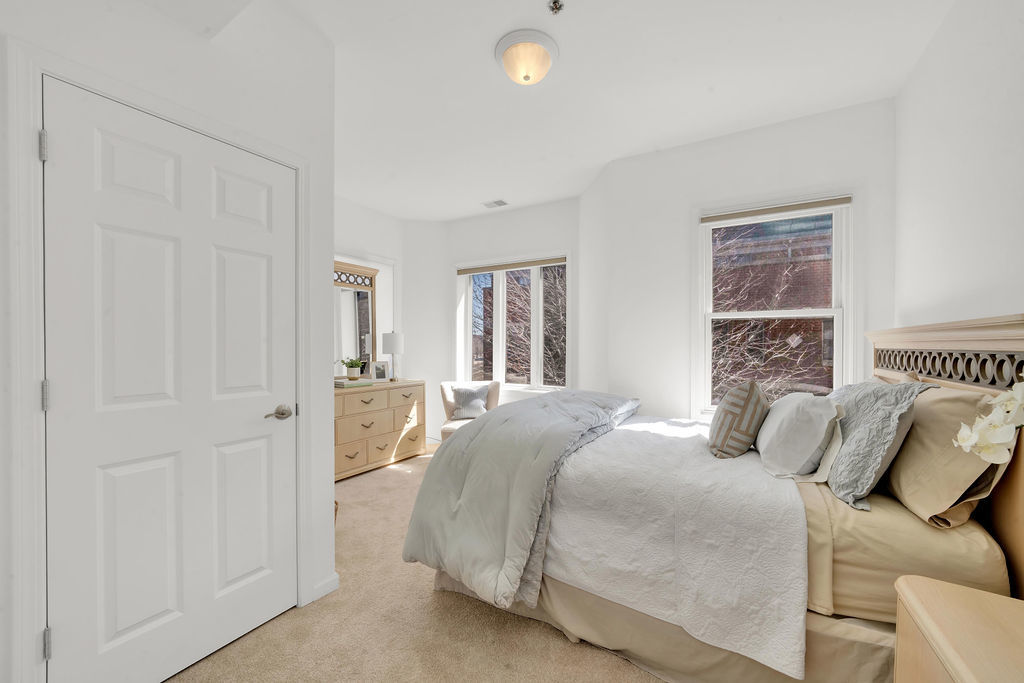 324 East 17th Street Chicago, IL 60616 - Photo 16 of 25 a bedroom with a bed and a window