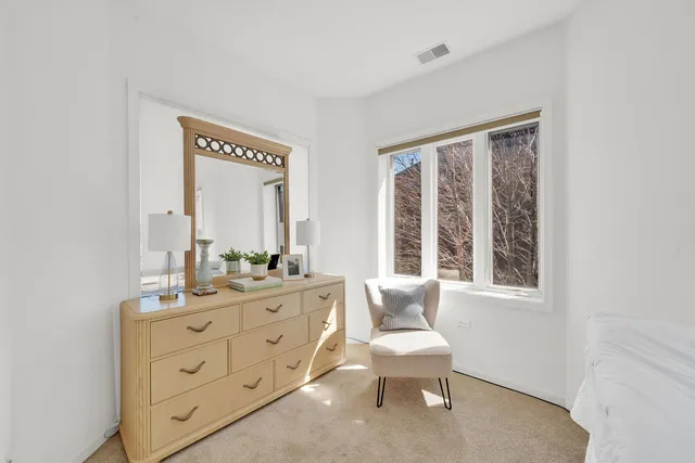 a room with a bed and a chair