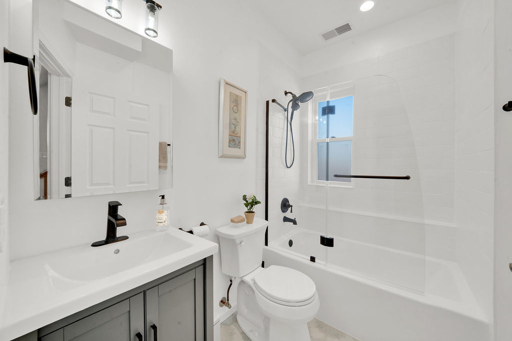 324 East 17th Street Chicago, IL 60616 - Photo 18 of 25 a white toilet sitting next to a bathroom sink
