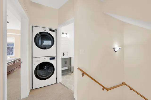 a view of a storage and utility room with washer and dryer